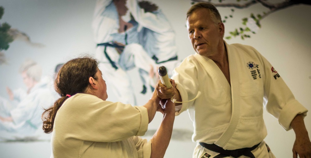 Aikido students practicing a technique at Hyland Hills Dojo in Westminster, CO